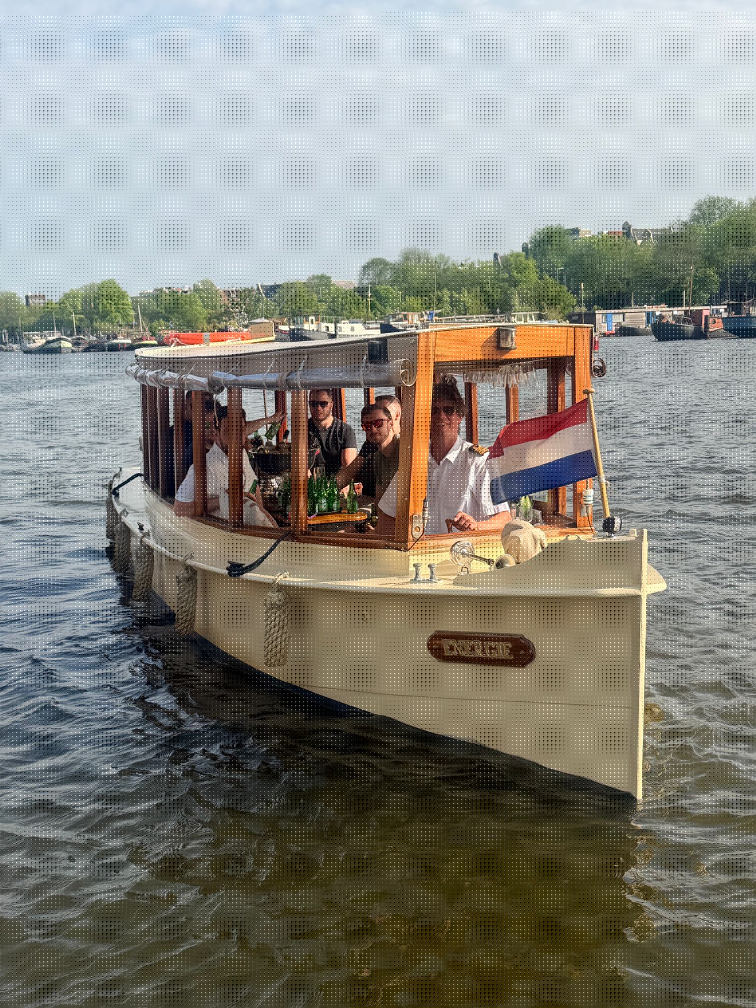 Historic salon boat Energie cruising through Amsterdam